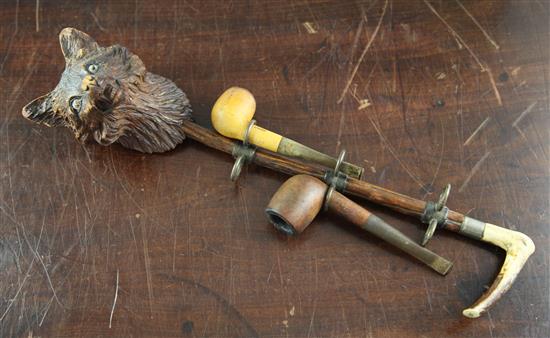 A fox head pipe rack, Ronson & Dunhill table lighters, a carved South German tobacco box and humidor